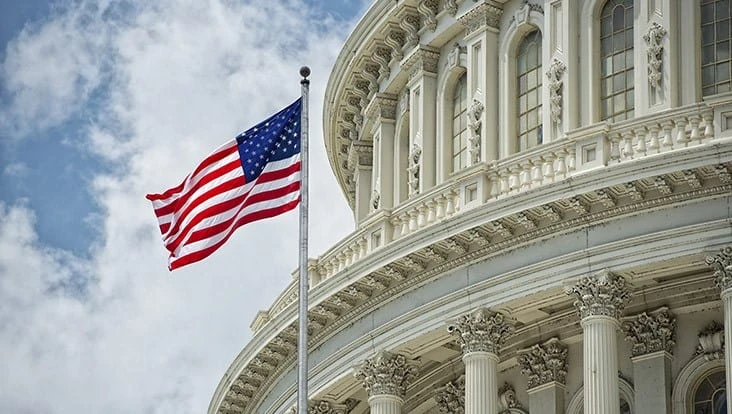 American flag in front of capitol building