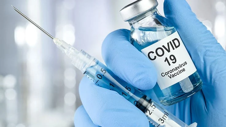 covid-19 vaccine and syringe