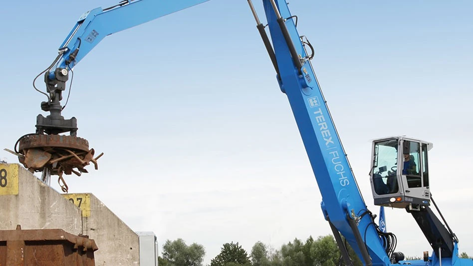 blue material handler with scrap magnet loading a container