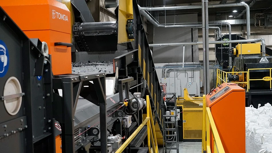 an optical sorter made by tomra and a conveyor feeding it