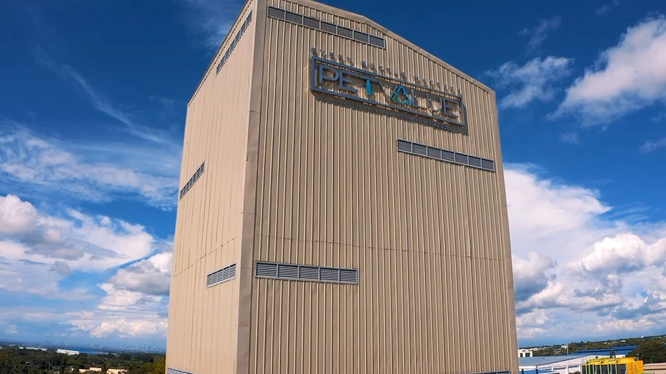 tall building against blue sky with white clouds