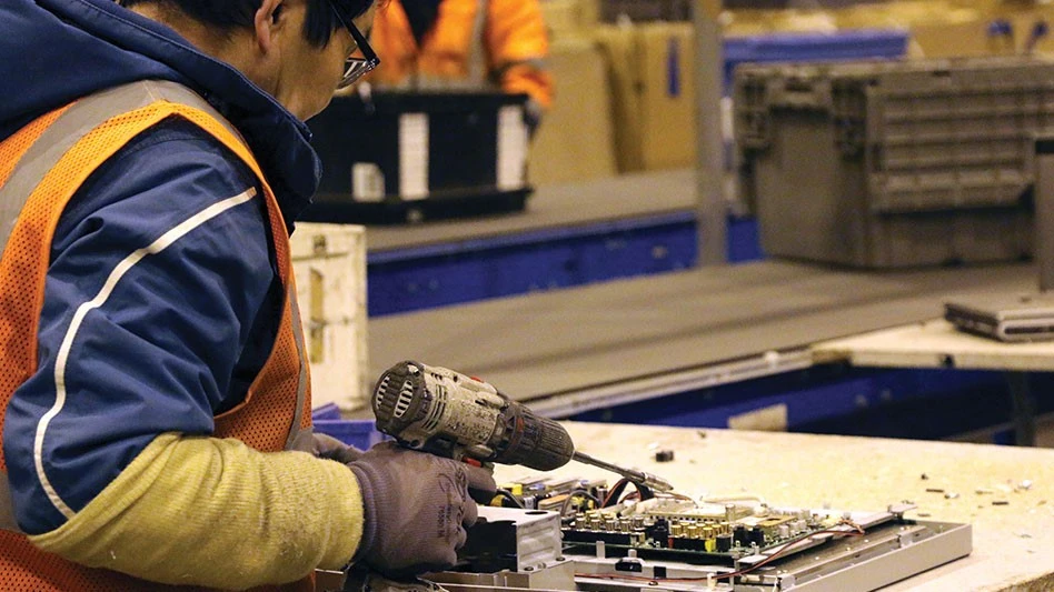 person fixing an electronic device