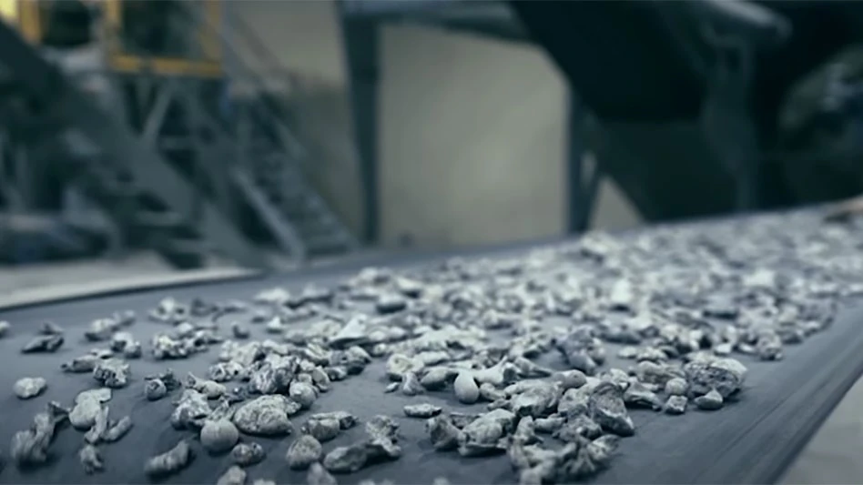 shredded aluminum on a conveyor belt