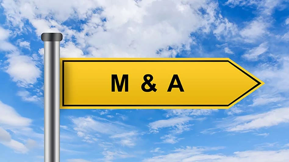 yello flag that reads M&A on background of a blue sky with white clouds