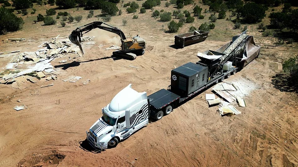 SSI's Dual-Shear M120 on the back of a semi truck processing wind turbine blades.