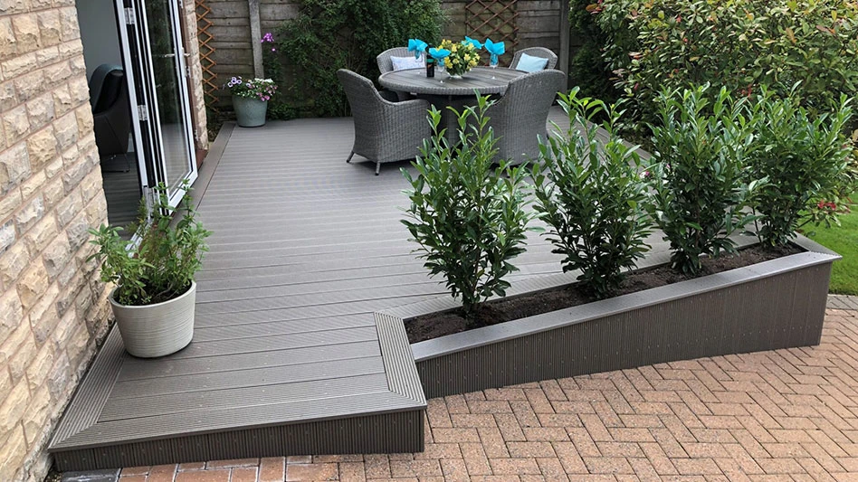 a deck made with recycled plastic with built-in planter