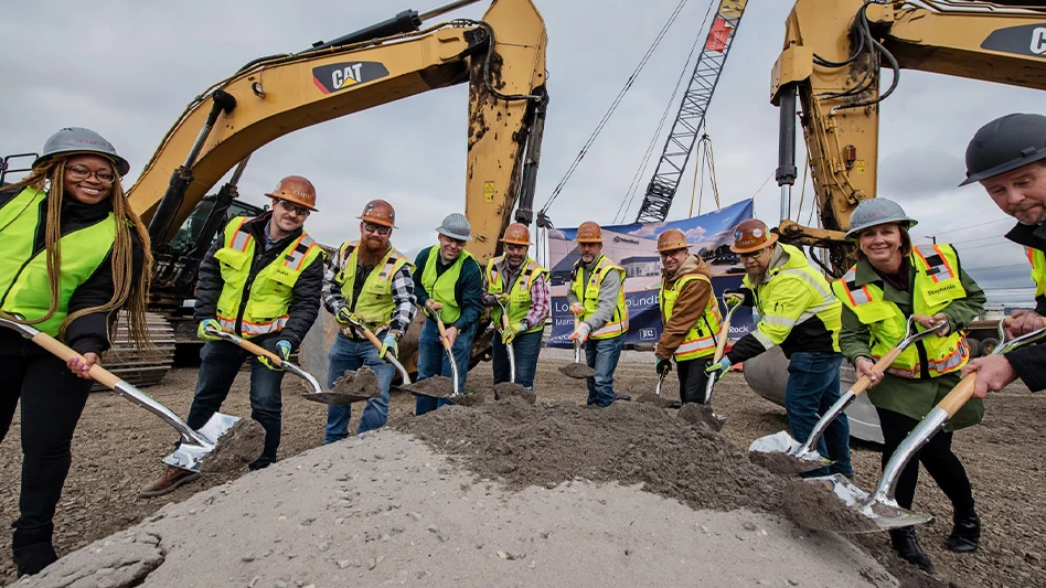 construction workers break ground at longview, washington, corrugated box plant site