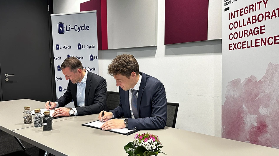 Anfreas Krinninger of Kion Group AG and Elewout Depicker of Li-Cycle sit down to sign their companies' agreement to pursue the recycling of lithium-ion batteries.