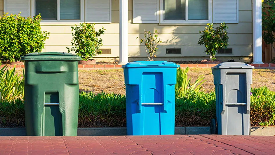Recycling bins lined up on street