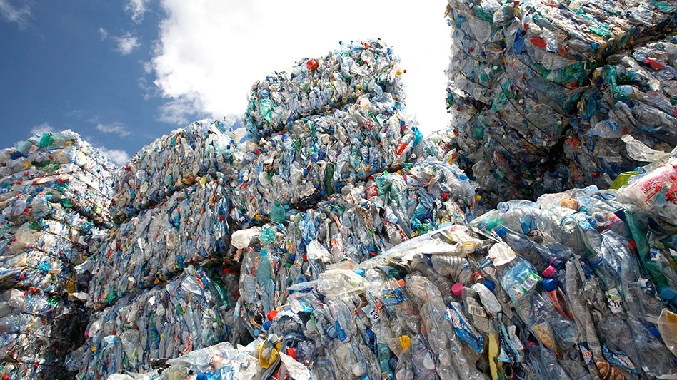 bales of mixed plastics against a blue sky