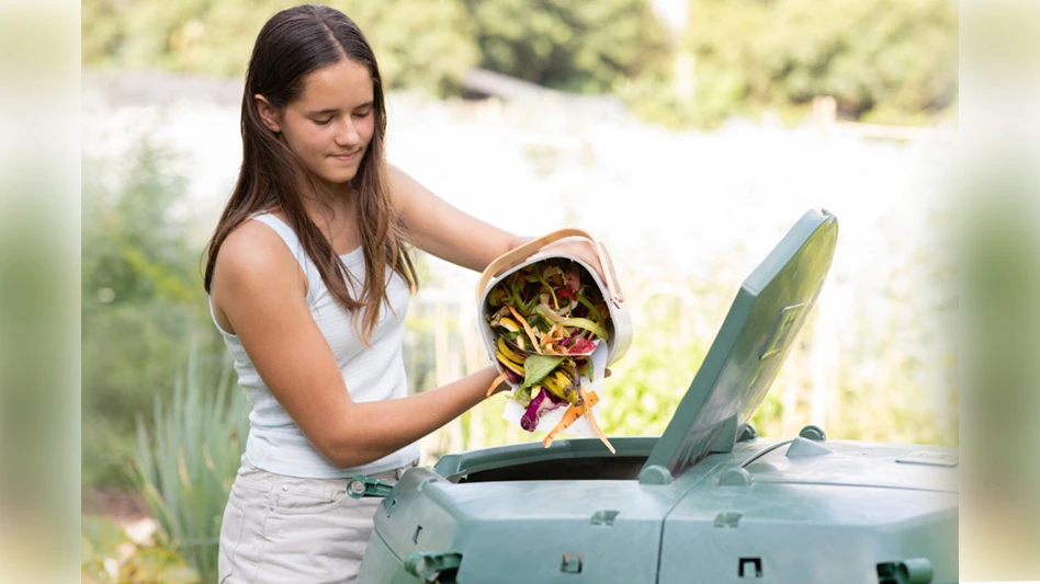 Woman emptying materials into container