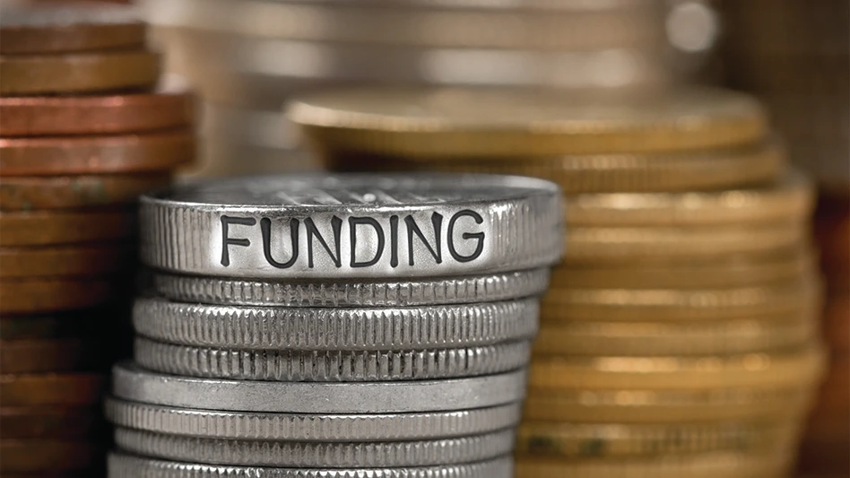 Stacks of coins with the word "funding" written into a coin.