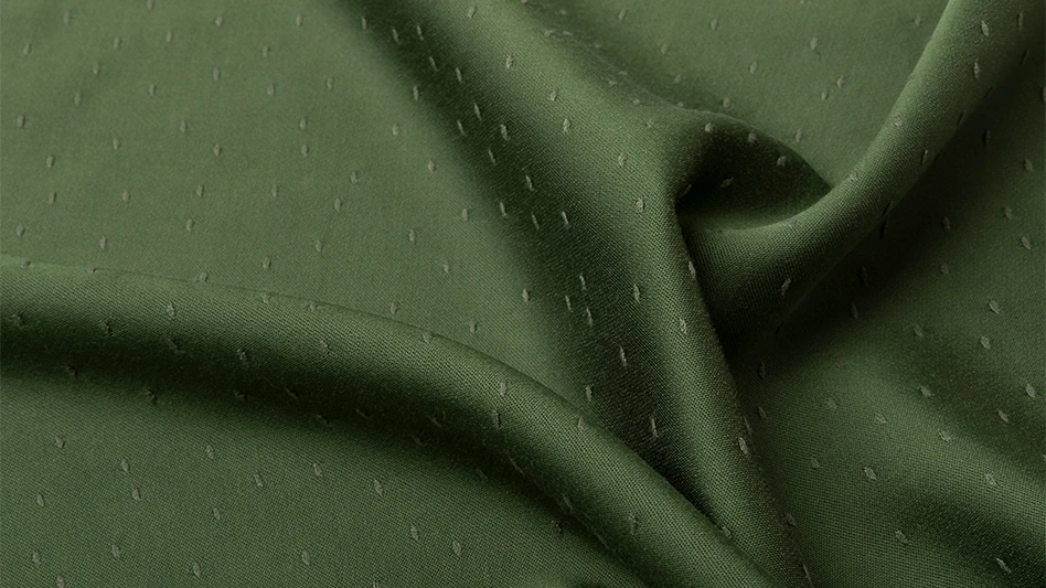 green fabric made with naia renew