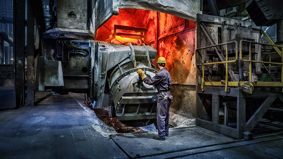 man in front of a furnace