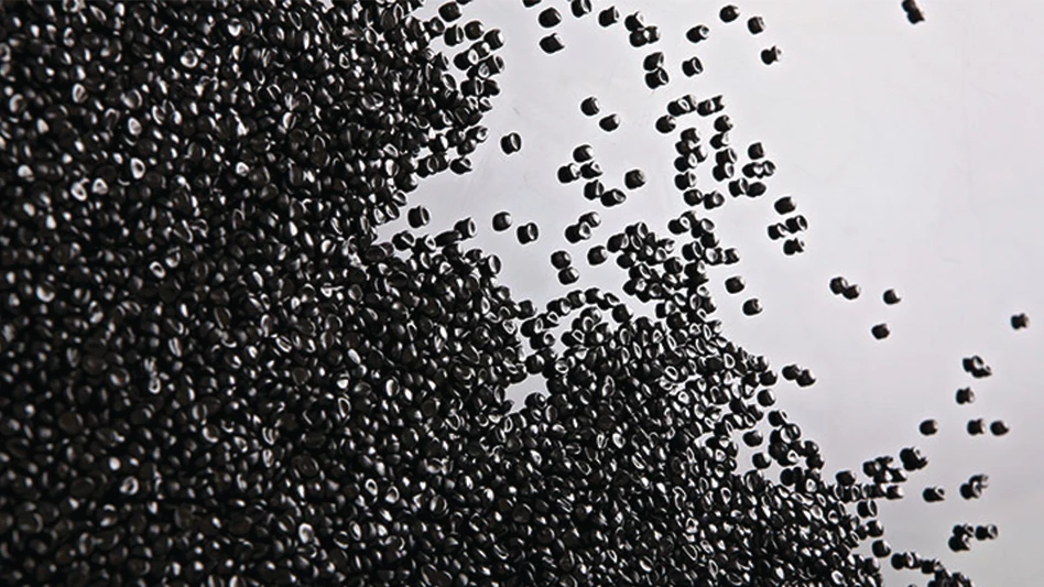 black HDPE pellets on a white background.