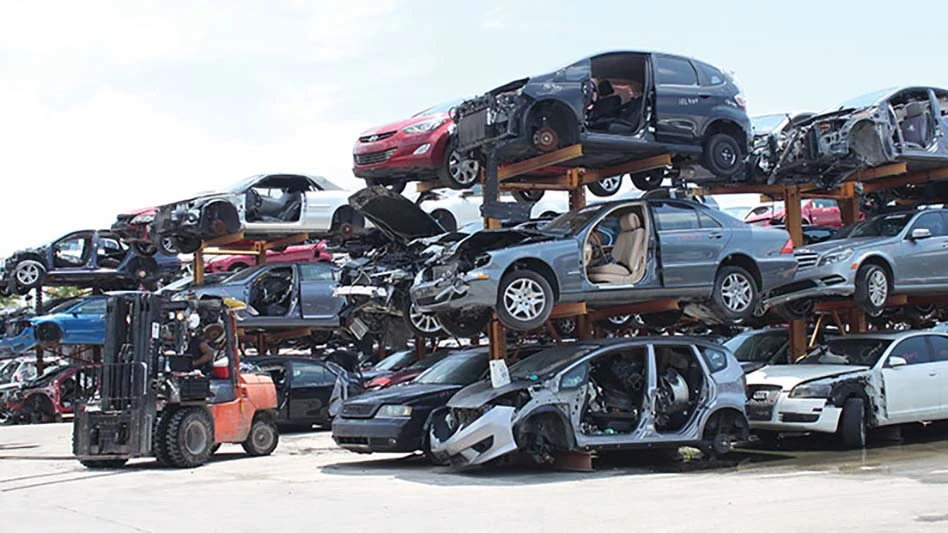 stacks of used cars for parts harvesting