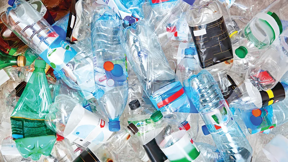 A mixed pile of plastic water bottles.