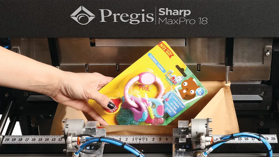 A hand places a toy in a Pregis EverTec Automated Mailer.