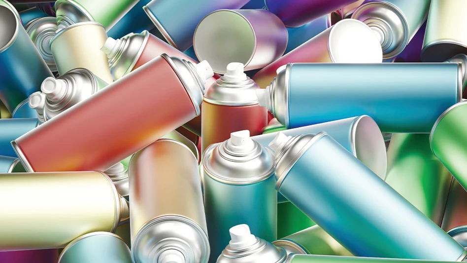 A pile of aerosol cans in different metallic colors.