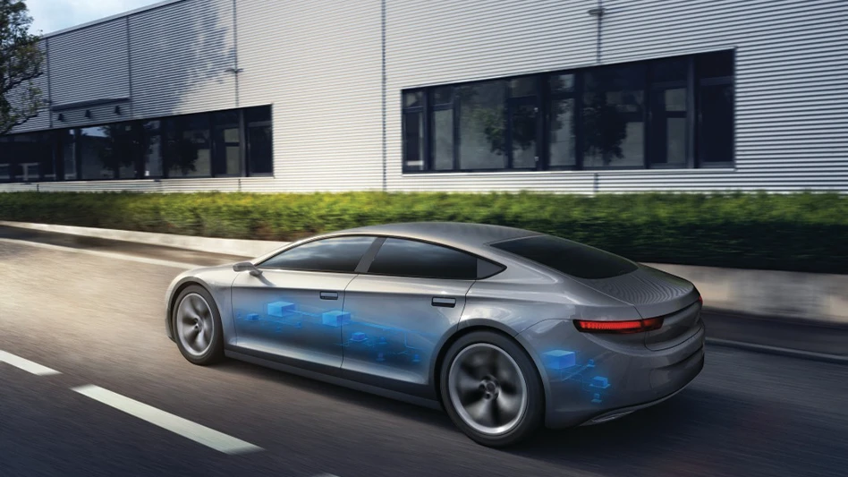 A rendering of a silver electric vehicle driving on a road, with a view of the battery, highlighted in blue, near the bottom of the car.