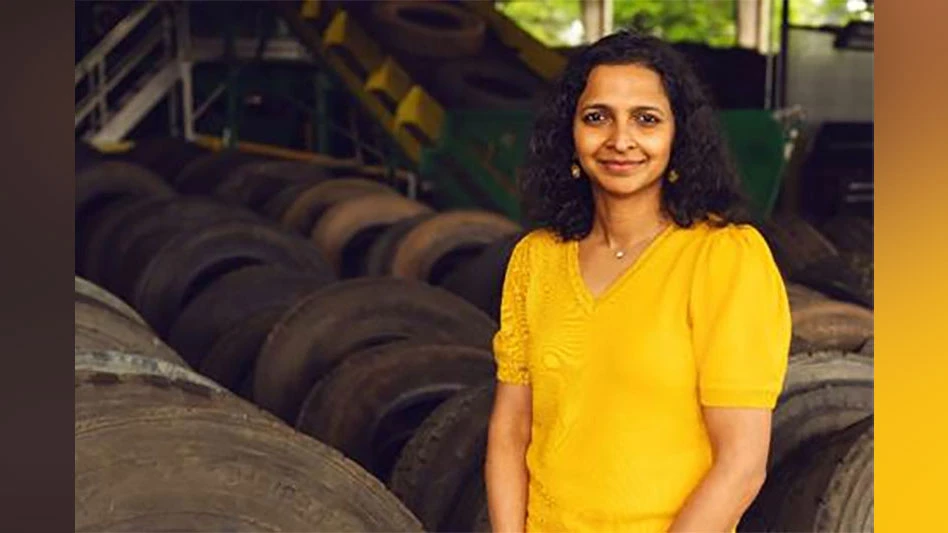 a smiling woman in a yellow shirt