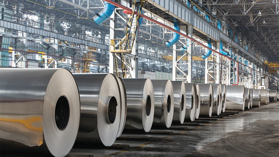 Rolls of aluminum sit in a production shop.