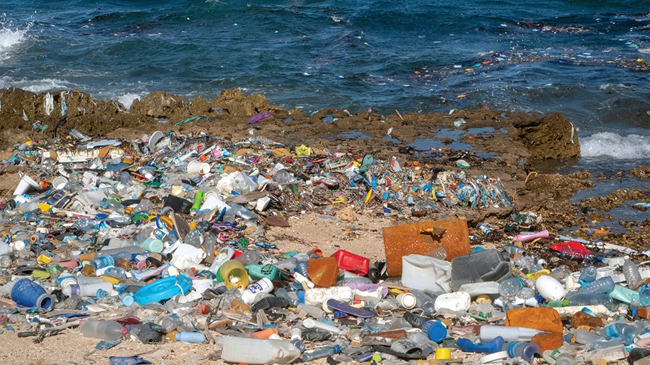 Plastic scrap washed up on a rocky beach.