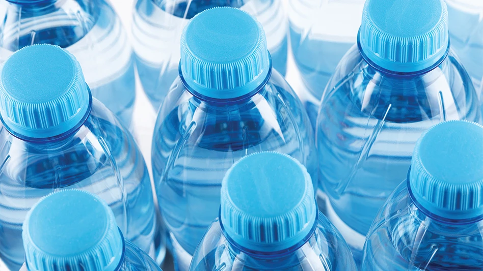 Closeup of clear plastic water bottles.