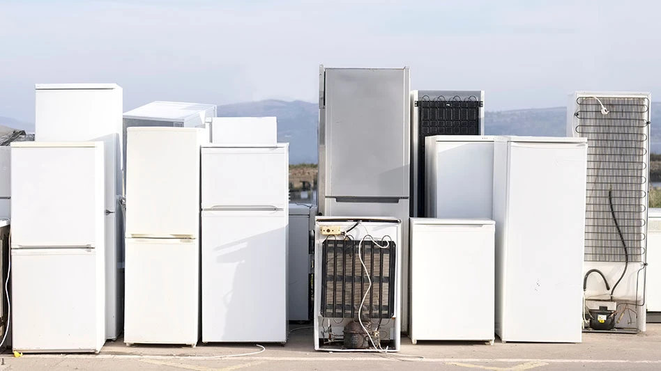 a lineup of old refrigerators