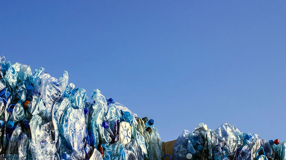 PET bottle bales against a blue sky