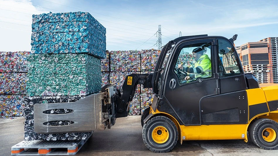 forklift moving UBC bales